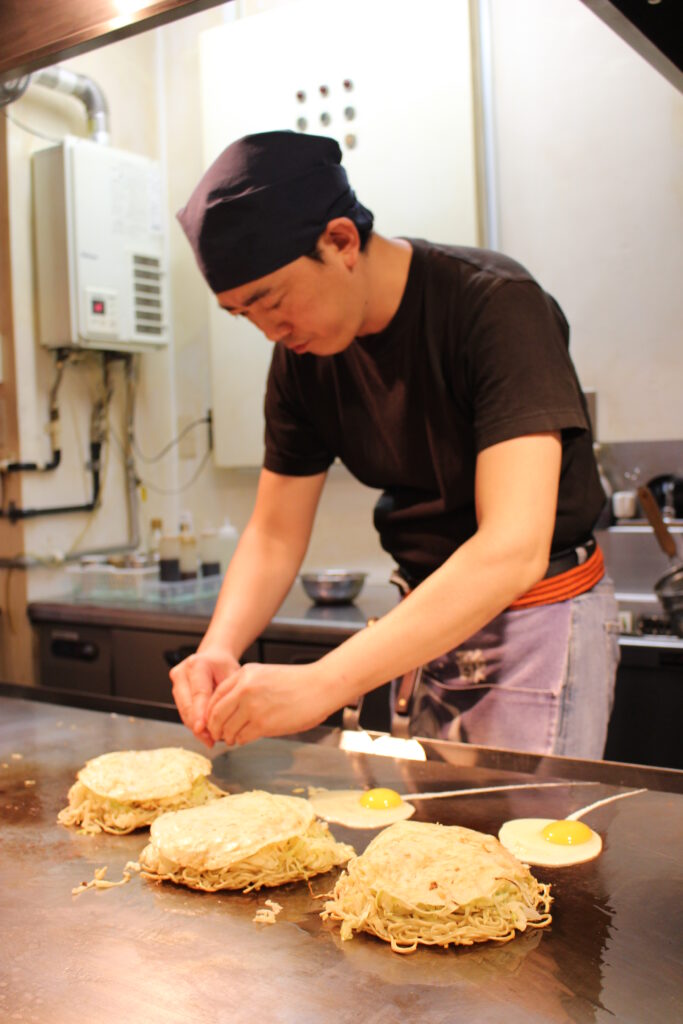 Preparing okonomiyaki in Hiroshima